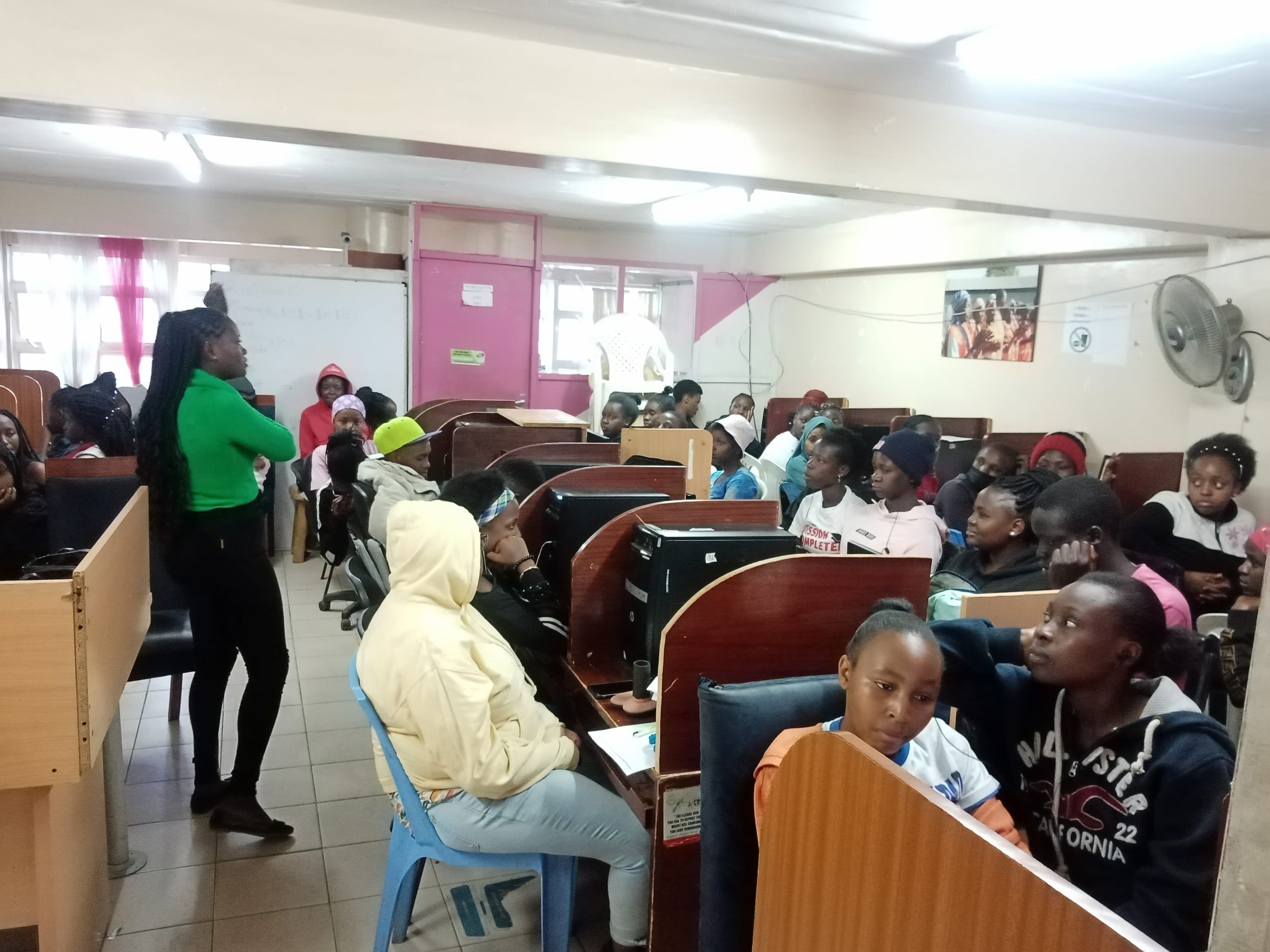 Trainer leading a hands-on session with young participants